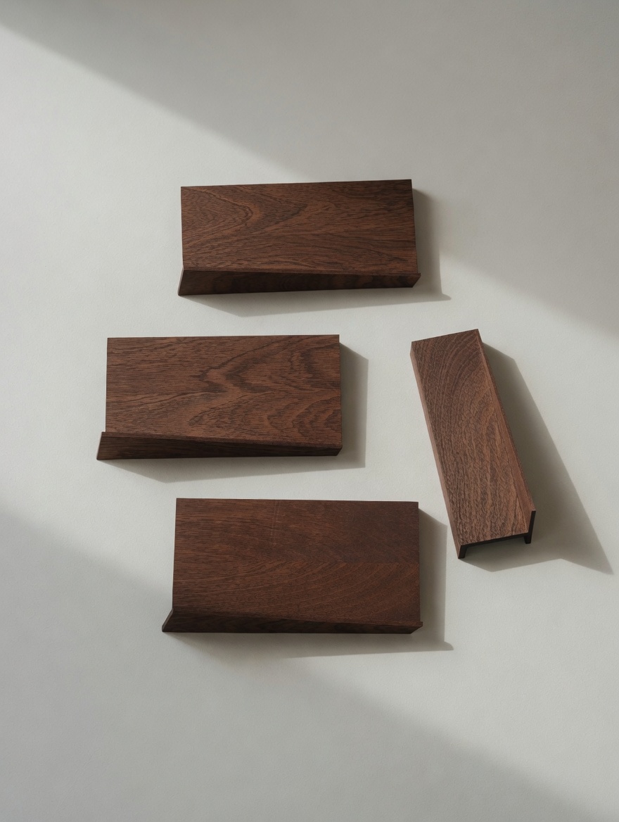 Four walnut floating shelves on a wall, top-down